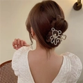 Golden bear-shaped hair claw clip with rhinestones worn by a model in a bun hairstyle - Gold Rhinestone Bear(FJ070)