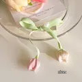 Tulip hair clip with green satin bow, white pearl, and pink floral ribbon dangles - Pink White Tulip Ribbon Hair Clip