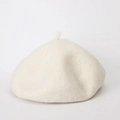 Close-up of cream wool beret showing soft textured fabric and classic autumn shape - Adjustable / Off White