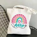 White canvas tote bag featuring nurse illustration with rainbow and stethoscope - Style C16 (No Inner Pocket/No Zipper)