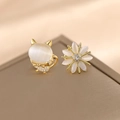 Chic cat and daisy mismatched stud earrings with opalescent stones in gold finish - Cat's Eye + Gold Edge Snowflake