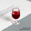 Macro detail of mini 3D resin wine glass pendant showing 38x21mm size and 6.5g weight - Burgundy