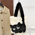 Detail of white plush cat tote bag with black feline cartoon eyes and soft fur texture - White