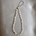 Minimalist beaded phone strap featuring white shell charms and golden metal accents - White Shell Heart Style