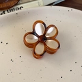 Close-up of vintage amber flower hair claw clip with pearlescent resin petals - Gold Flower Small