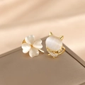Golden cat and four-leaf clover brooch set with white stones on a brown velvet box - Clover + Cat's Eye Stone Set