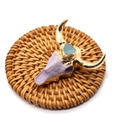 Purple resin bull skull pendant with gold trim and blue gemstone on a woven mat - 47x47mm / Blue/Purple/Gold