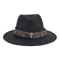 Detail of black wide brim cowboy hat with brown leather band and silver bull head emblem - Silver Bull Skull Leather