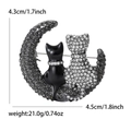 Elegante broche van katten op een halve maan met zilveren strass-steentjes en metaal - Zwart