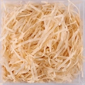 Light brown shredded raffia paper filler for gift boxes in clear packaging - Champagne