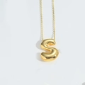 Golden balloon letter S pendant necklace with shiny cross chain in minimalist style - Letter S