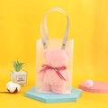 Pink bear-shaped towel with red ribbon in a clear PVC gift bag on a vibrant background - 30x30cm (No Packaging) / Pink