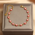 Detail of red enamel evil eye charms on a gold-plated stainless steel adjustable bracelet - Red