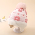 Detail of winter knit hat featuring pink floral pattern and large faux fur pom-pom - One Size (3-8Y) / White
