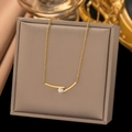 Minimalist gold necklace with a teardrop pendant and pearl on a premium display box - Cross Pearl (H601)