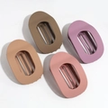 Flat lay of four matte leopard print hair claw clips in beige, brown, purple, and pink - Matte Light Coffee/Khaki/Dark Pink/Purple