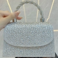 Sparkling silver rhinestone evening handbag with a twisted metal handle and flap design - Silver