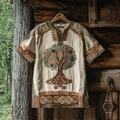 Detail of tree of life embroidery on beige linen short sleeve shirt hanging in forest - S / Beige/Earth Tone (Tree of Life)