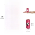 Magenta biodegradable pet waste bags with white paw prints in rolls and flat view - 1 Micron Biodegradable Pink Paw Print