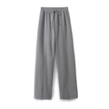 Detail of grey wide-leg sweatpants with elastic drawstring waist and vertical seam stitching - Gray Pants