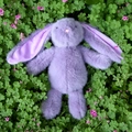 Charming lavender plush bunny with long ears sitting on a green clover garden background - 25cm / Purple