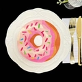 Flat lay of colorful donut shaped napkins on a ceramic plate with golden cutlery - Colorful Floral