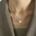 Elegant silver snake chain necklace with a lustrous white pearl worn by a model - White (XL40)