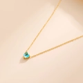18k gold plated heart necklace with light blue birthstone on warm beige background - March-Aquamarine