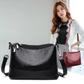 Women's faux leather snakeskin textured shoulder bag in black and red with top zipper - Black