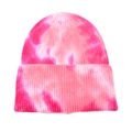 Detail of pink and white tie-dye knit beanie showing soft ribbed texture and folded cuff - Pink