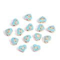 Light blue heart-shaped evil eye beads with golden alloy frame scattered on white surface - Heart / Blue