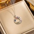 Silver bow necklace with multicolor rectangular gems on a golden jewelry box display - 316 Silver Colorful Donut