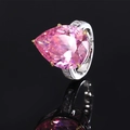 Elegant silver ring with pear-cut pink zircon stone and diamond-studded band on black mirror - Pink Zircon