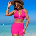 Close-up of bright pink two-piece bikini featuring a halter V-neck top and high-waisted shorts - M / Pink