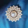 Luxurious golden brooch with white pearls in flower shape on navy silk background - Pearl Daisy Brooch