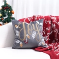 Gray Christmas pillow cover with gold Joy embroidery and red berry motifs on a sofa - Grey JOY Embroidery/Grey
