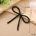 Detail view of a handcrafted black beaded bow keychain with exact dimensions and weight - Black Seed Bead Bow Pendant