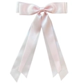Close-up of pink satin ribbon bow hair clip with soft texture and elegant streamers - Light Pink