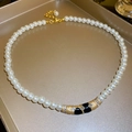 Elegant vintage pearl necklace with a black enamel flower pendant and gold accents - 44# Necklace - Gold - Arc (Pearl Strand)