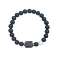 Detailed close-up of beaded bracelet with black stones and a white marble accent bead - Matte Black & White Turquoise Beads With Tourmaline