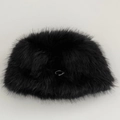 Detail of plush faux fur bucket hat in black with a silver metal ring ornament - One Size / Black