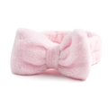 Zachte roze koraalvlies strik hoofdband voor gezichtswassen en make-up op wit - Roze