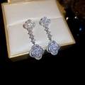 Macro shot of silver clover drop earrings with sparkling zircons on a jewelry box - Silver-Flower (14#Four-Leaf Clover)