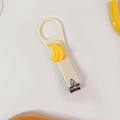 Beige stainless steel nail clipper featuring a cute yellow banana charm decorative design - White Banana