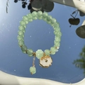 Elegant beaded bracelet featuring green round beads and a white cloud charm on a mirror - S048-white Peace Lock Donglin Jade Beaded Bracelet #sz349