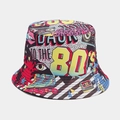 Detail of retro 80's pop art pattern print on a canvas bucket hat with vivid colors - 80s Style