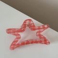 Star shaped hair claw clip featuring a classic red and white grid pattern design - Red Checkered Star Claw