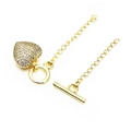 Detailed view of gold plated brass heart charm with micro-pave cubic zirconia and OT toggle clasp - Heart Pave Style