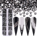 Close-up of 12-grid storage box with grey nail art rhinestones and decorated nail tips - SS4-SS12-3600Pcs/Box / Mineral Black