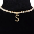 Golden choker necklace with crystal-encrusted letter S pendant on black velvet display - Letter S [Gold]